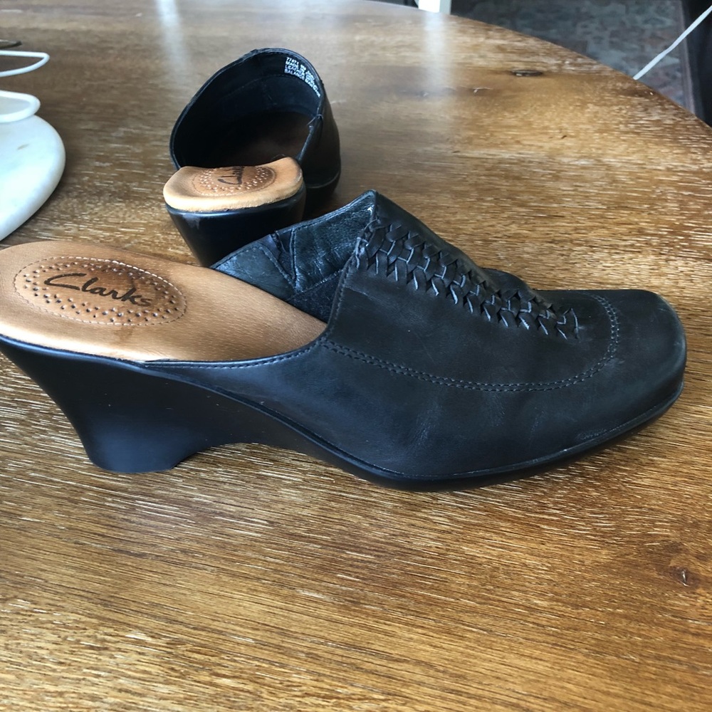 Clark’s black leather slip on clogs